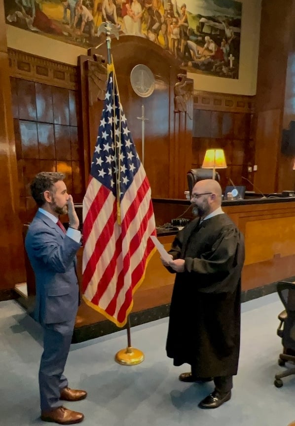Chief District Judge Travis R. McDonough administers the oath of office to new Magistrate Judge Michael J. Dumitru