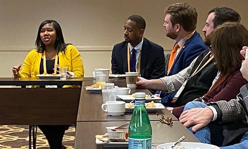 YLD delegates discuss a new LSAT rule during delegation breakfast
